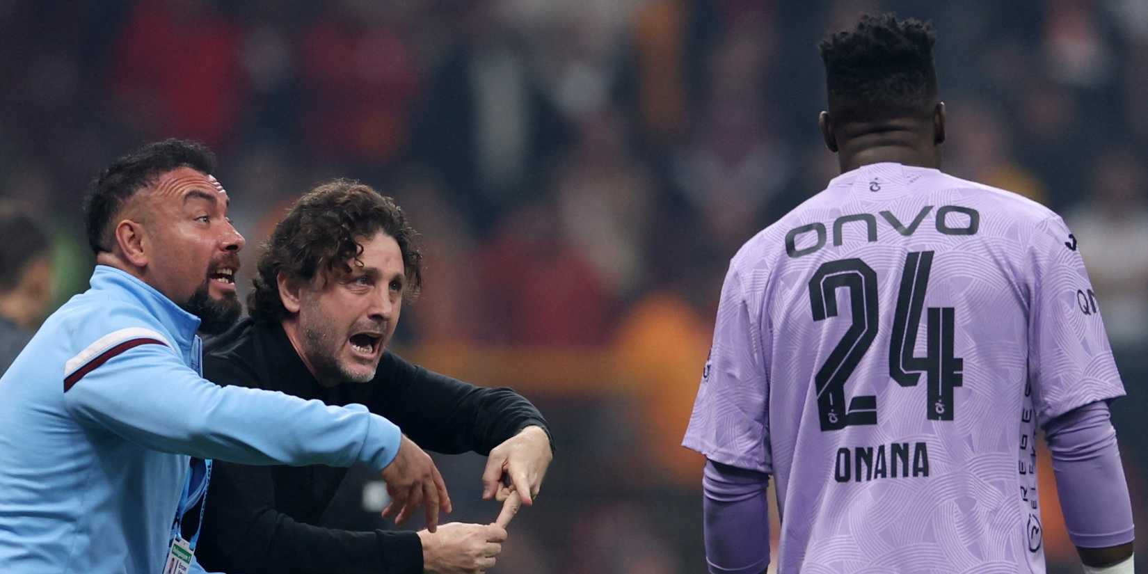 Trabzonspor coach Fatih Tekke gives instructions to Andre Onana