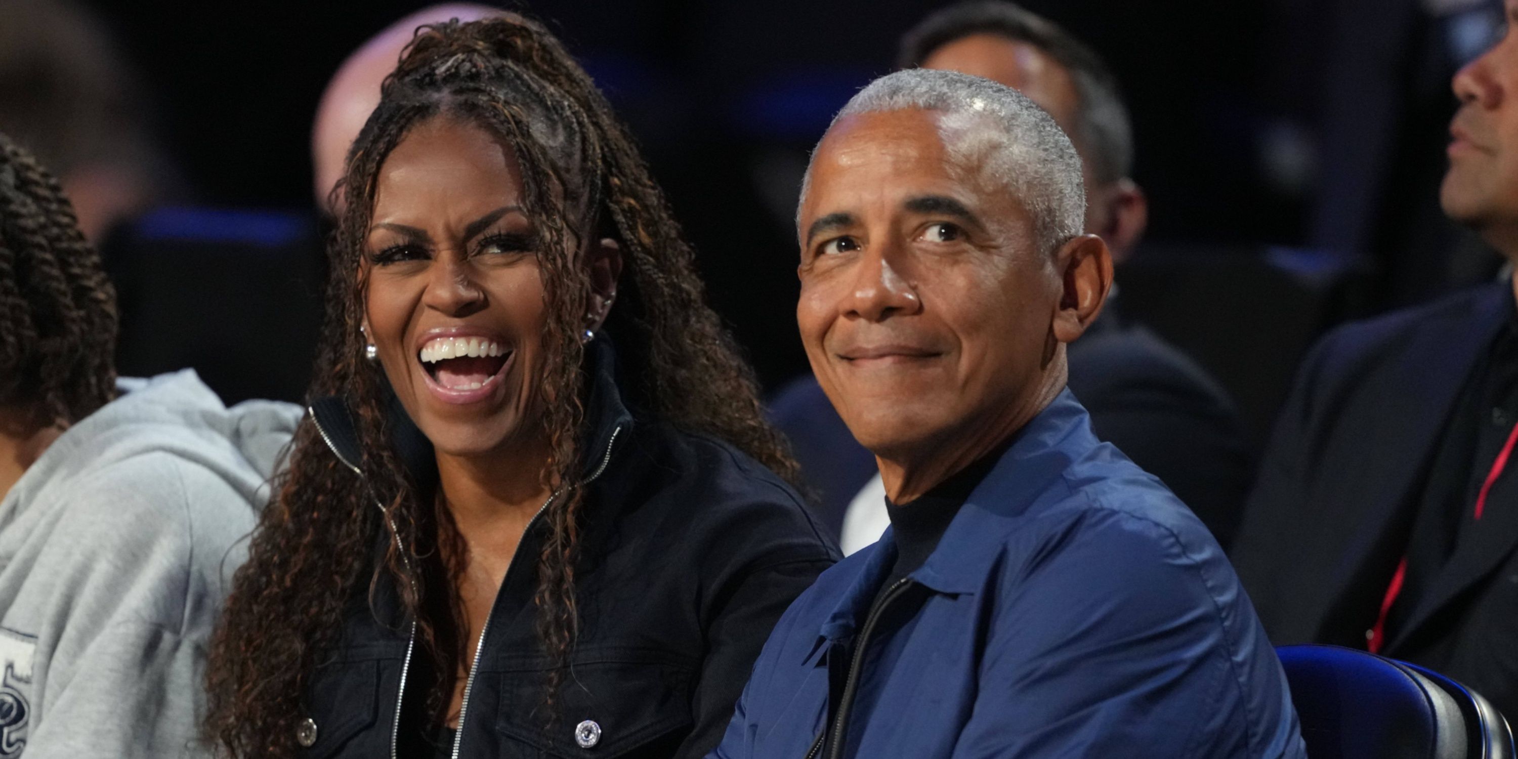 Former first lady Michelle Obama and former President Barack Obama look on before the start of the 75th NBA All Star Game at Intuit Dome