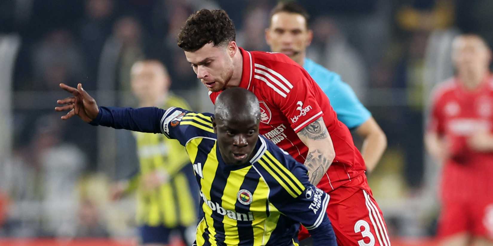 Fenerbahce's N'Golo Kante in action with Nottingham Forest's Neco Williams