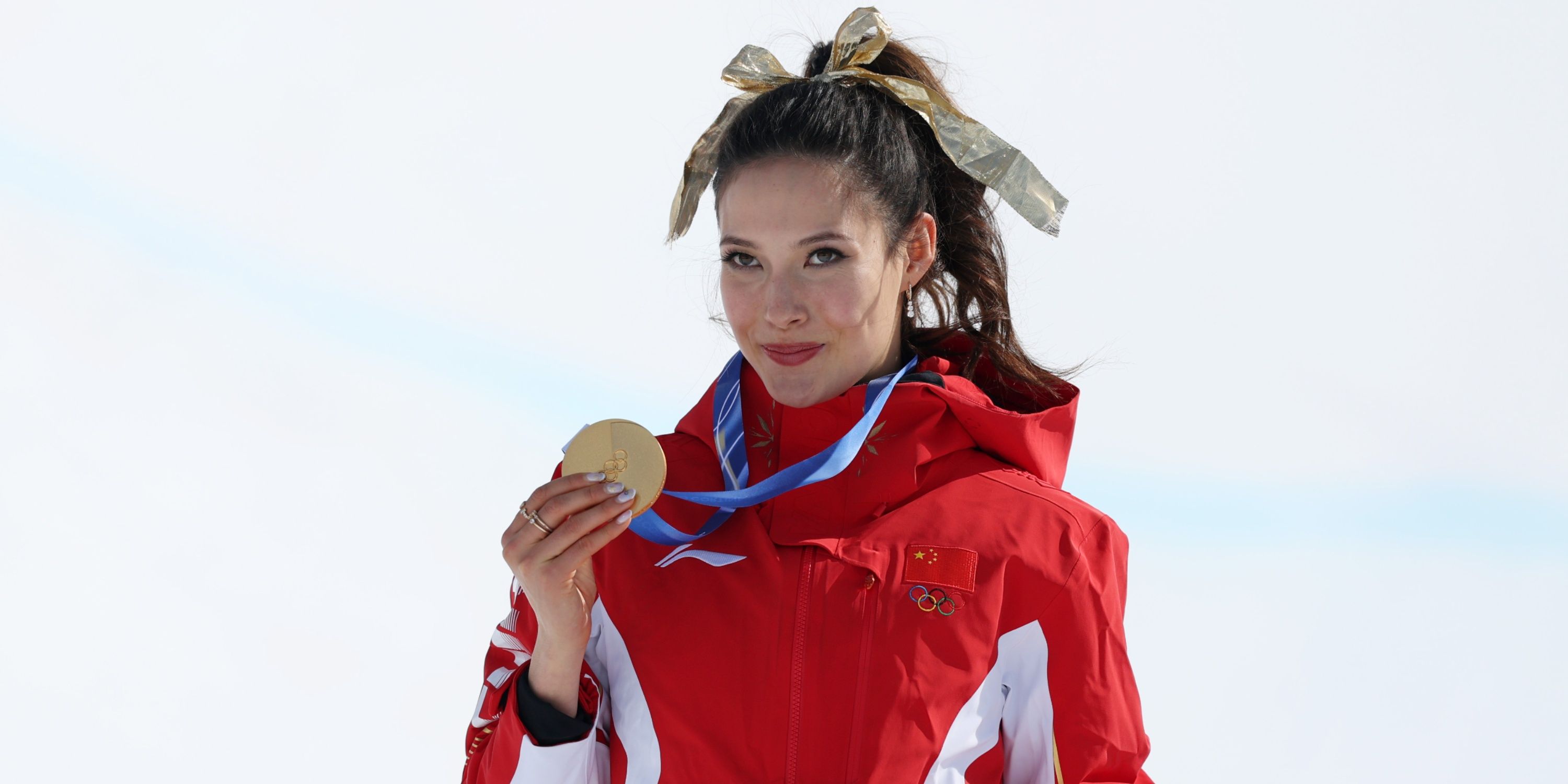 Gold medalist Ailing Eileen Gu of the People's Republic of China celebrates 