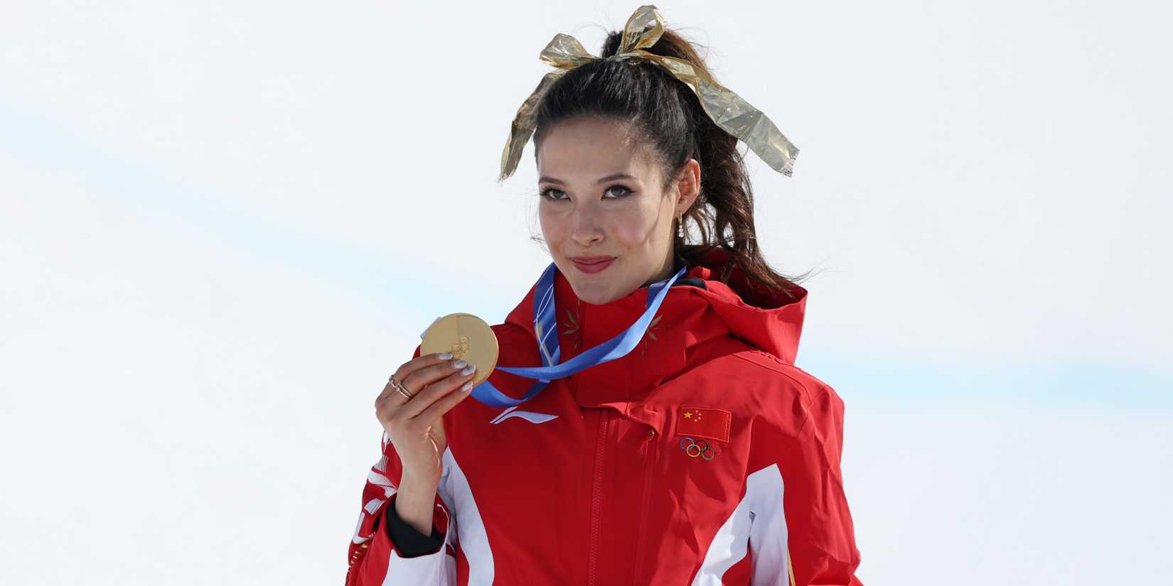 Gold medalist Ailing Eileen Gu of the People's Republic of China celebrates 