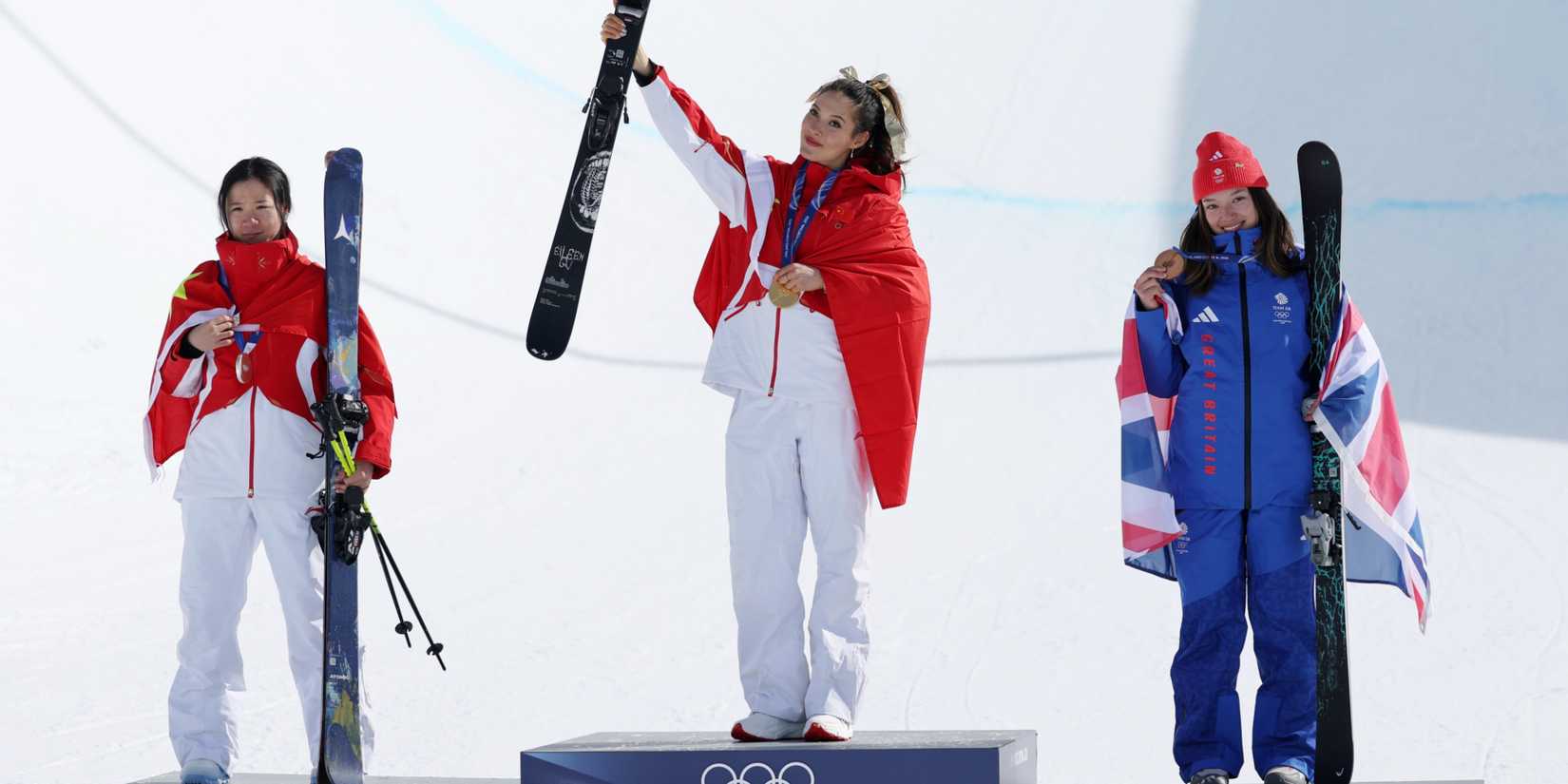 Silver medalist Fanghui Li of the People's Republic of China, gold medalist Ailing Eileen Gu of the People's Republic of China, and bronze medalist Zoe Atkin of Great Britain during medal ceremony