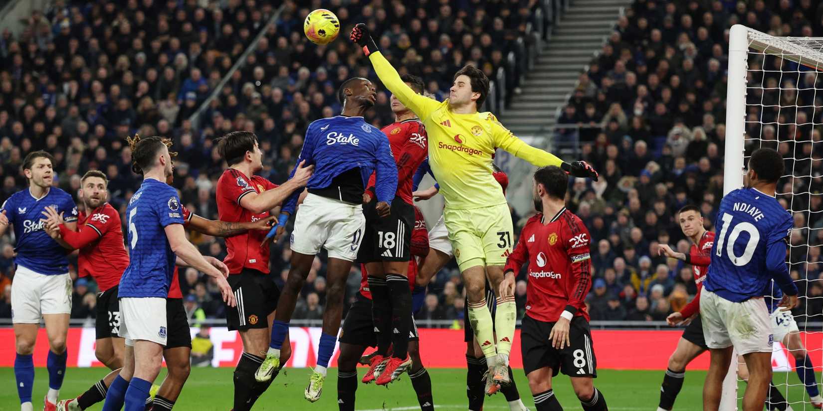 Man Utd goalkeeper Senne Lammens punches an Everton corner clear