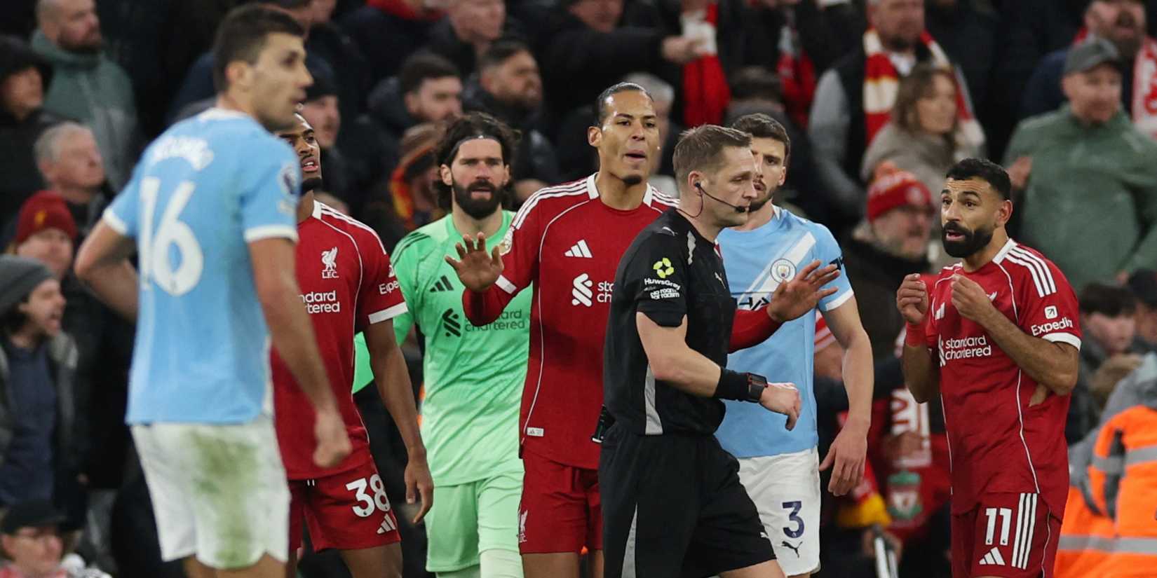 Liverpool's Virgil van Dijk and Mohamed Salah react after referee Craig Pawson awards a penalty to Manchester City