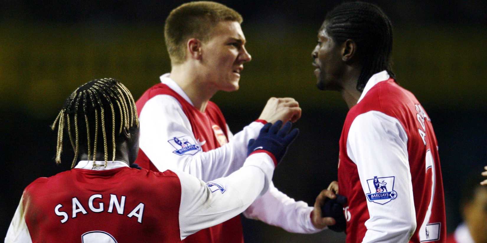 Arsenal's Nicklas Bendtner (C) argues with team mate Emmanuel Adebayor (R)
