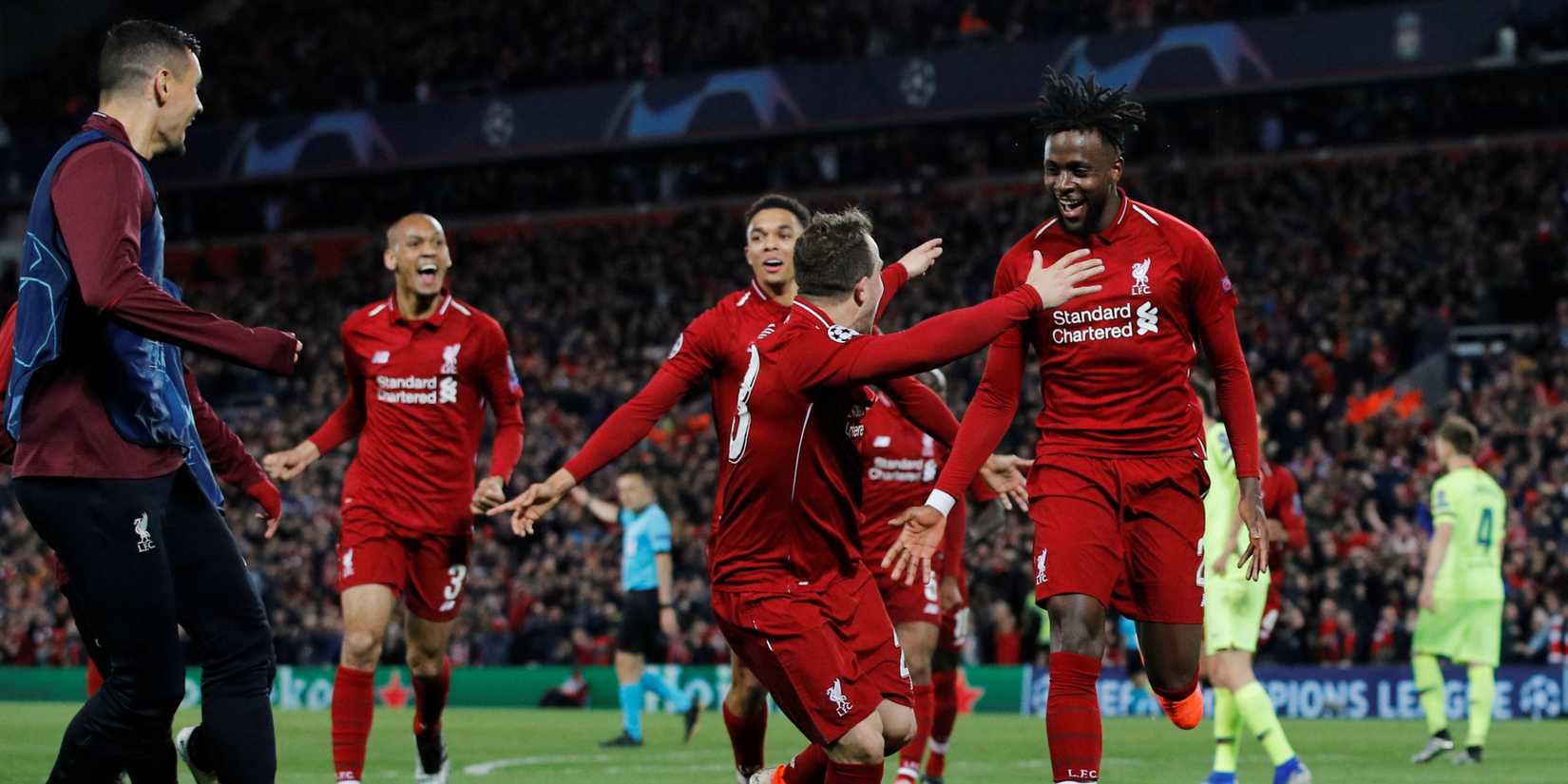 Liverpool's Divock Origi celebrates scoring their fourth goal with Xherdan Shaqiri, Trent Alexander-Arnold and team mates