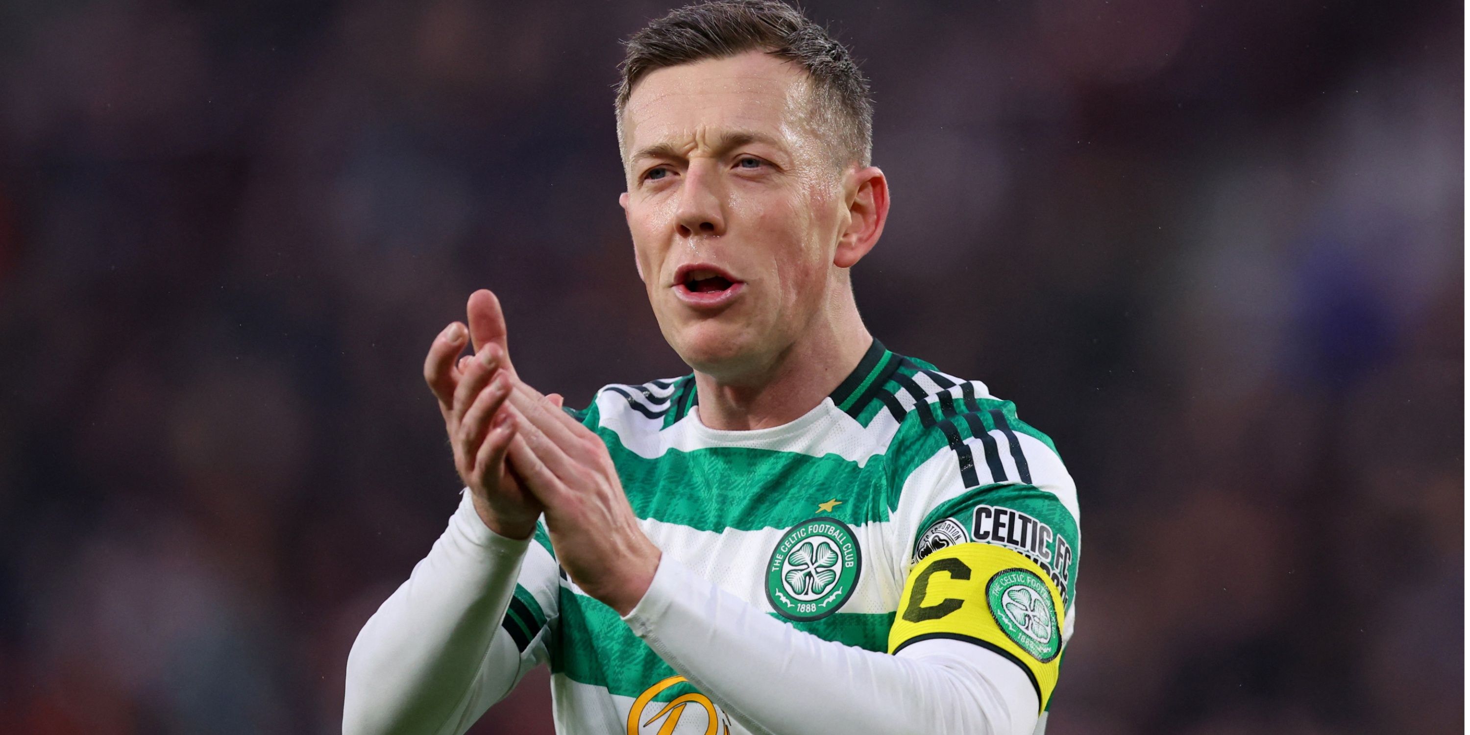 Celtic captain Callum McGregor applauds the fans