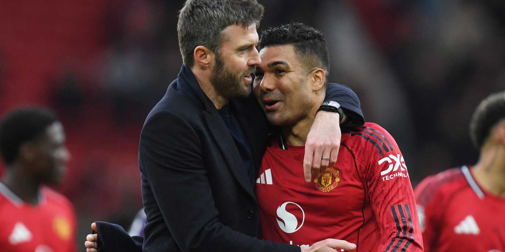 Manchester United caretaker manager Michael Carrick embraces Casemiro