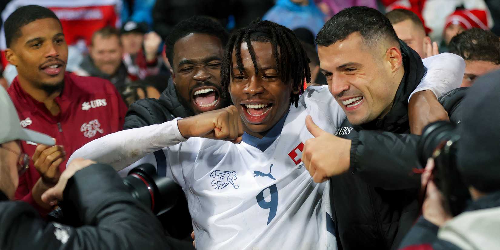 Johan Manzambi celebrates with Swiss teammate Granit Xhaka