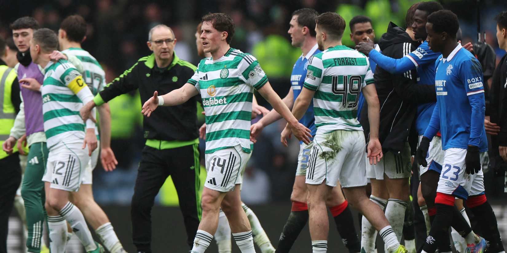 Celtic's Luke McCowan and James Forrest with Rangers' Djeidi Gassama at the end of the match
