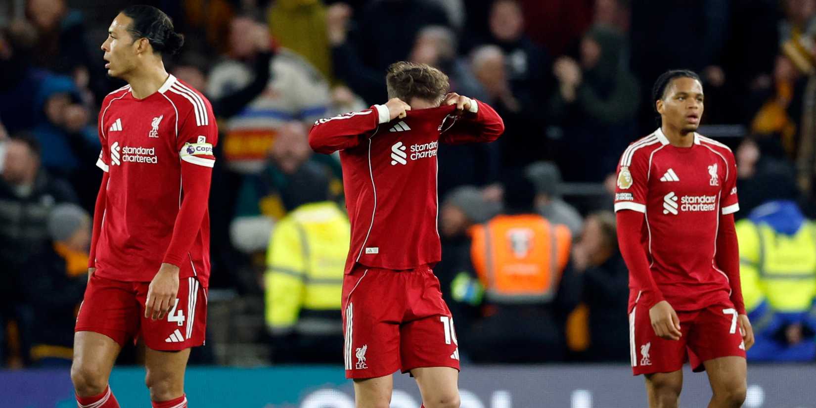 Liverpool's Alexis Mac Allister, Virgil van Dijk and Rio Ngumoha look dejected after Wolverhampton Wanderers' Andre scores their second goal