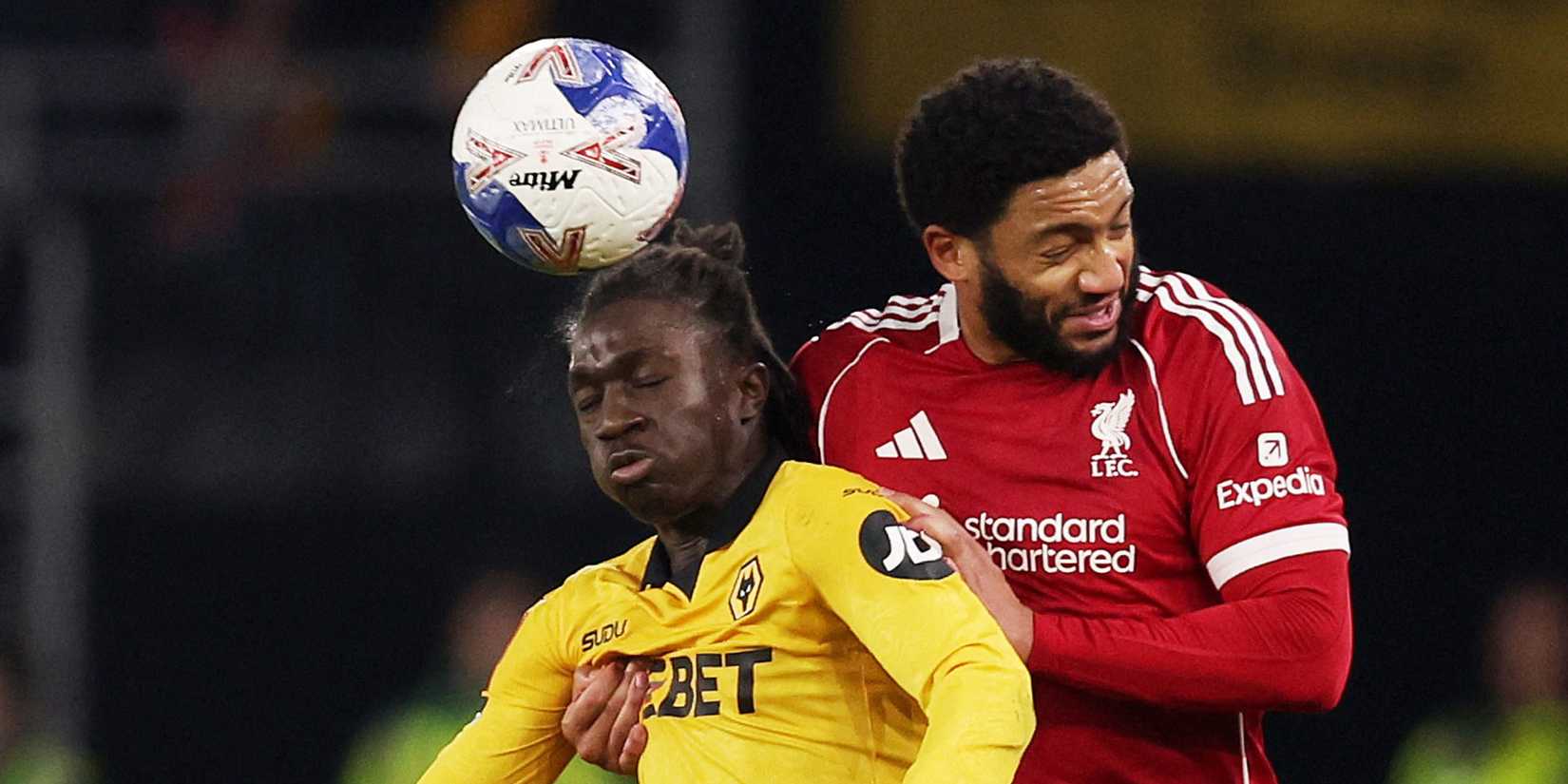 Joe Gomez contests with Wolves defender