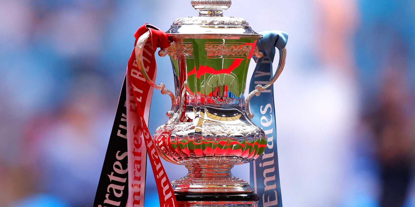 The FA Cup trophy is displayed inside Wembley stadium