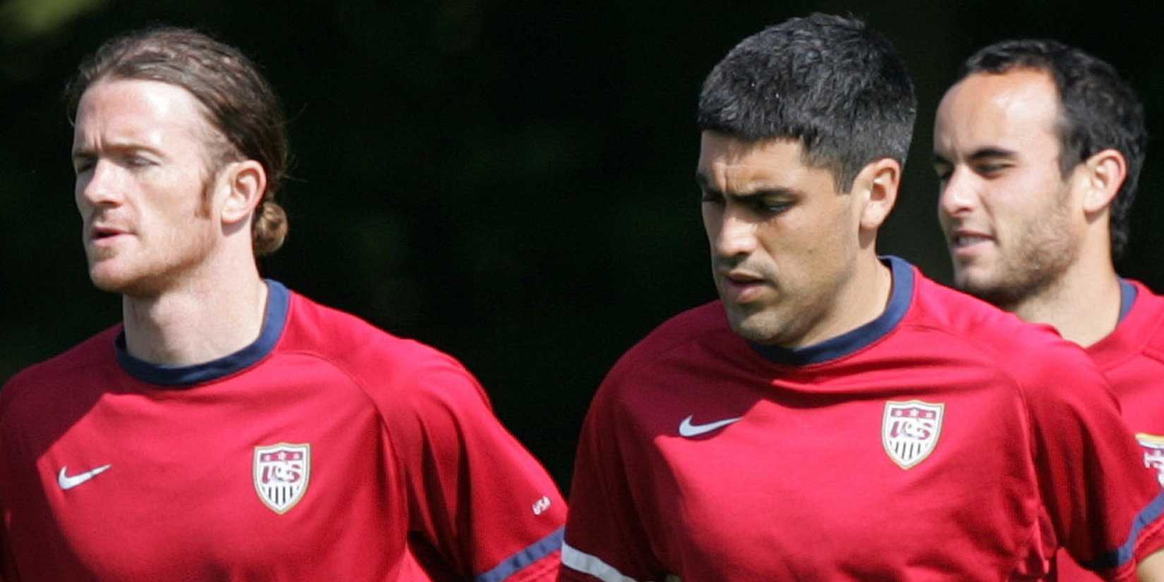 John O'Brien (L), Claudio Reyna (C), and Landon Donovan of the U.S. national soccer team run during a training session