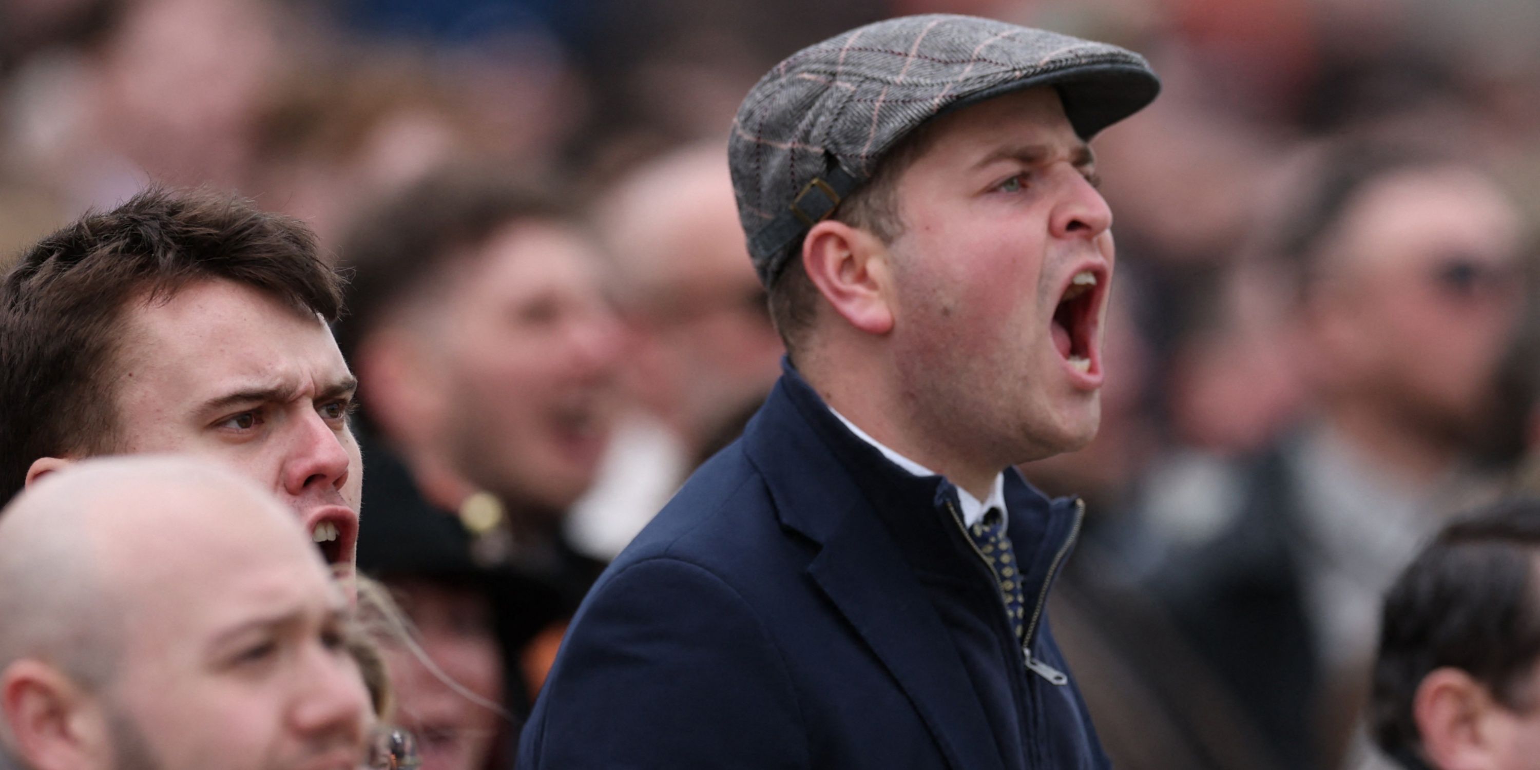  Racegoers react during the Cheltenham Festival