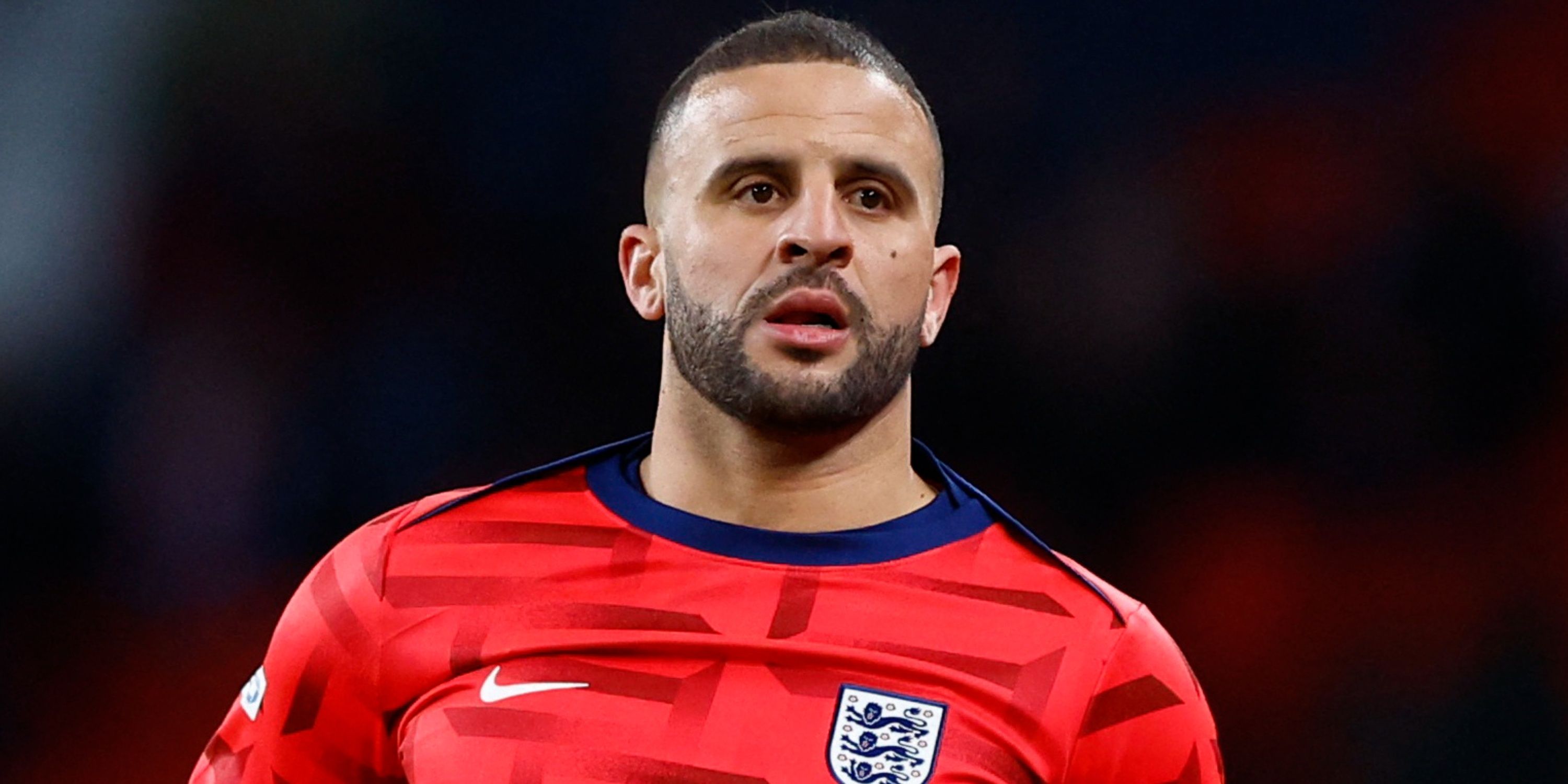 Kyle Walker warms up for England