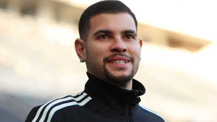 Newcastle United midfielder Bruno Guimaraes smiles as he walks into St James' Park