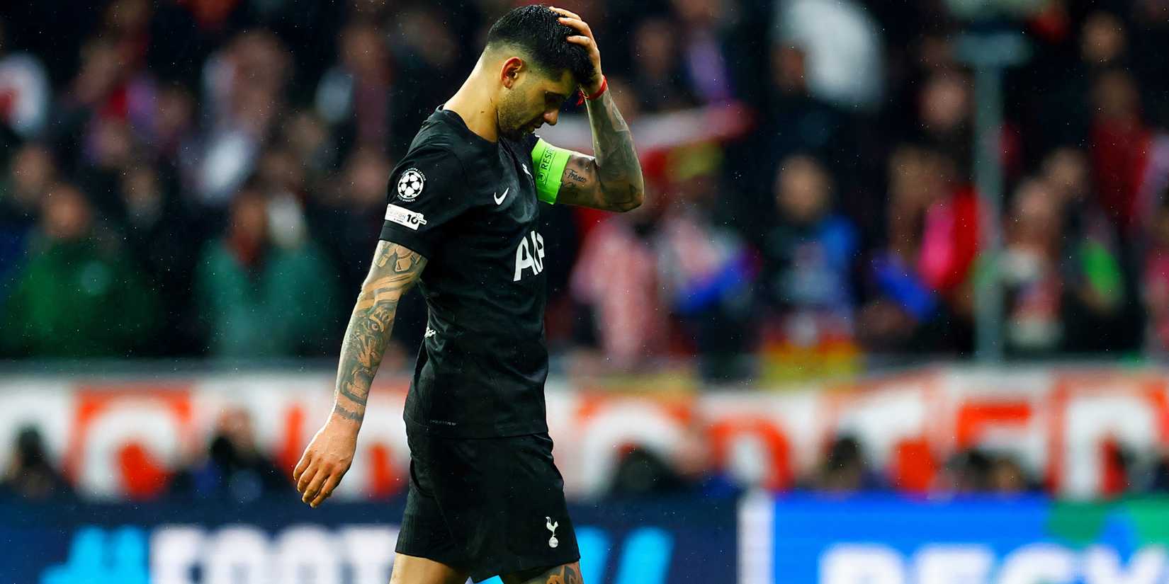 Cristian Romero walks off with a suspsected concussion at the end of Atletico Madrid vs Tottenham