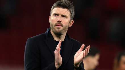 Manchester United caretaker manager Michael Carrick claps the fans