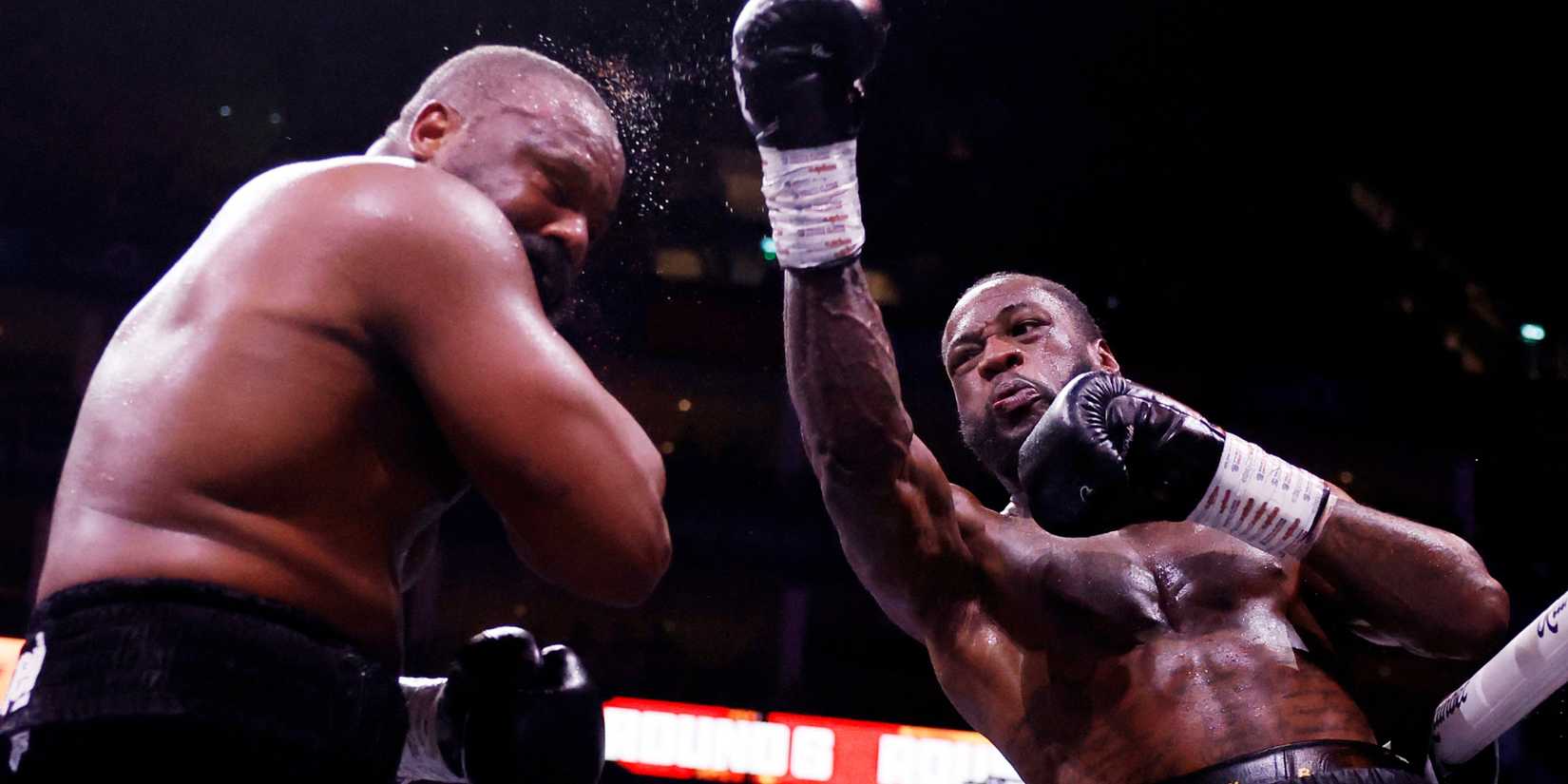 Deontay Wilder lands a punch on Derek Chisora