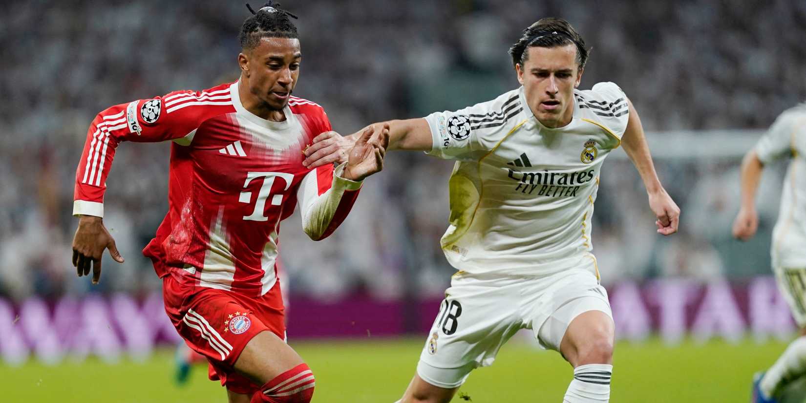 Alvaro Carreras and Michael Olise compete for the ball in Real Madrid v Bayern Munich