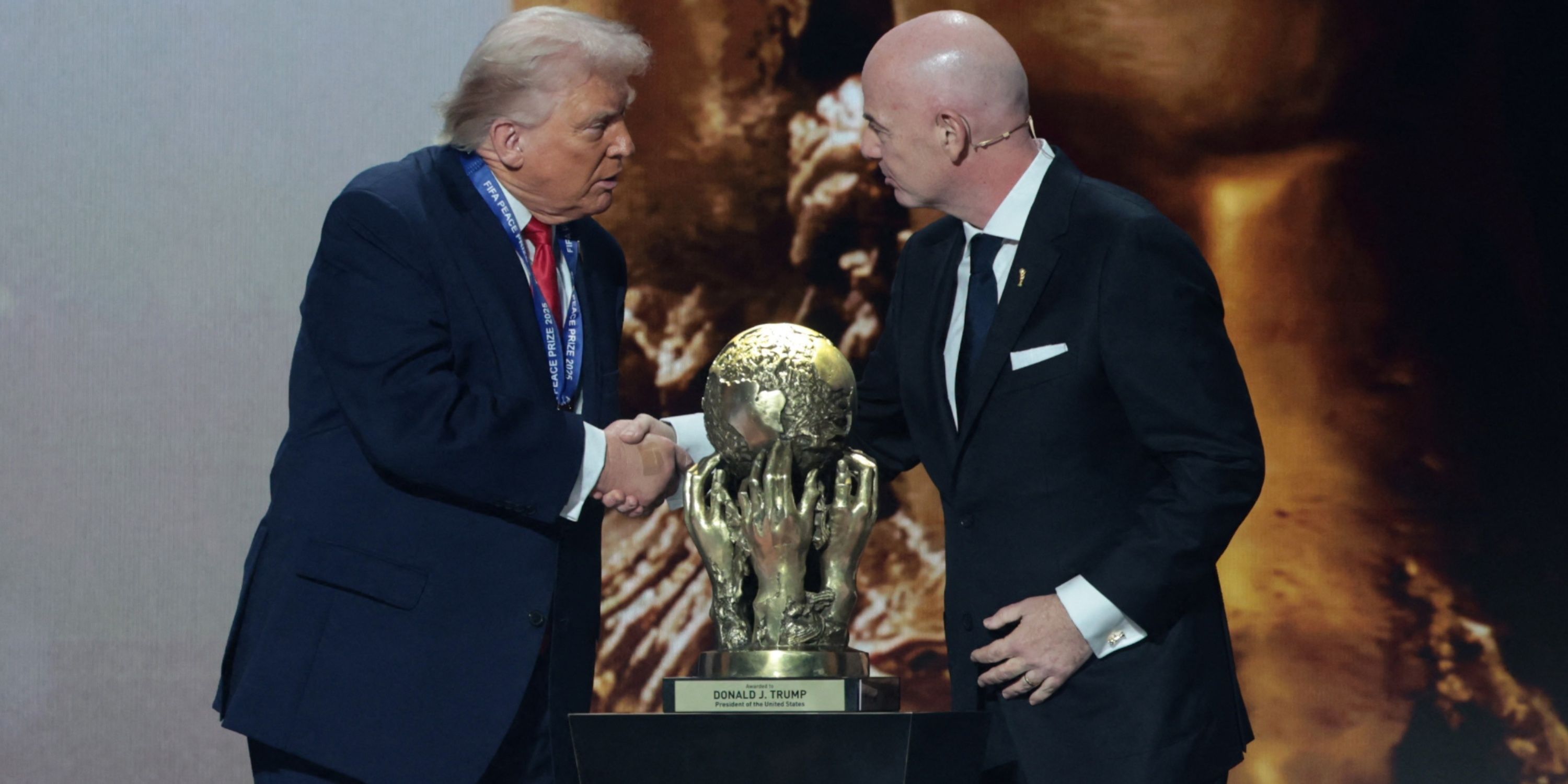 Donald Trump is given the FIFA Peace Prize by FIFA president Gianni Infantino