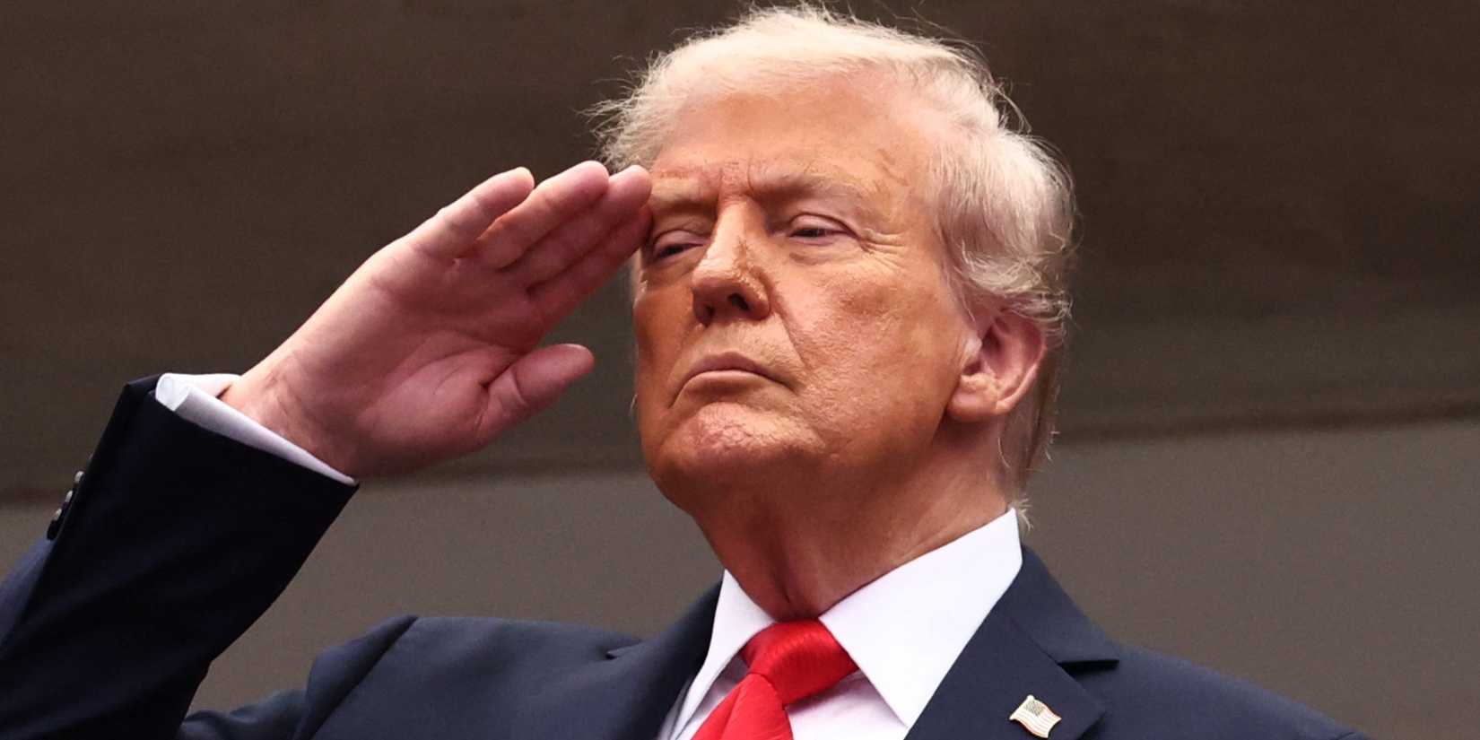 U.S. President Donald Trump is pictured saluting during the national anthem ahead of the final match between Italy's Jannik Sinner and Spain's Carlos Alcaraz