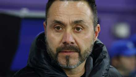 Roberto De Zerbi looks out from the dugout