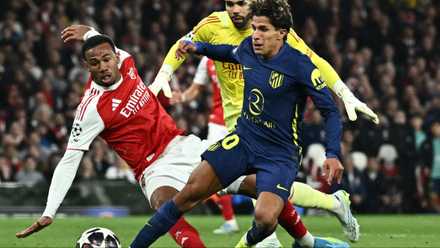 Arsenal's Gabriel Magalhaes makes last ditch challenge on Atletico Madrid's Giuliano Simeone