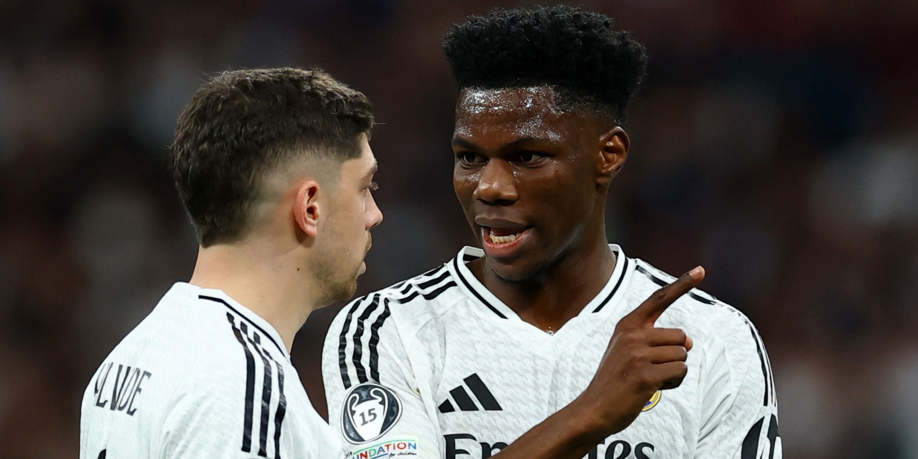 Real Madrid's Federico Valverde and Aurelien Tchouameni talking