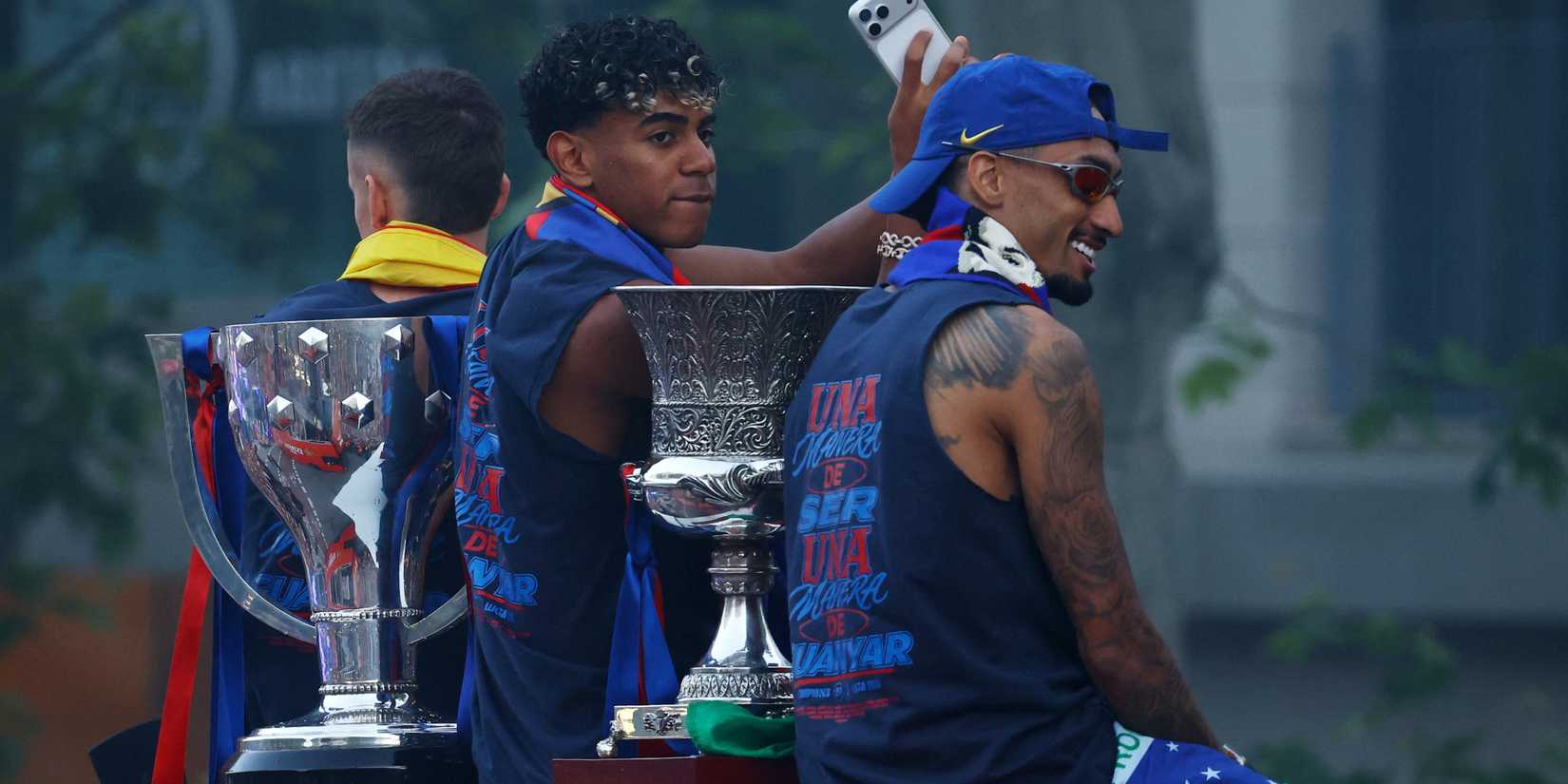 Lamine Yamal and Raphinha at Barcelona's trophy parade