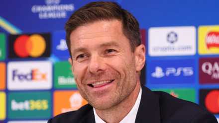 Xabi Alonso smiles in a press conference while working as Real Madrid manager