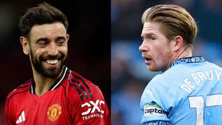 Bruno Fernandes (L) smiles during a Manchester United game alongside Kevin De Bruyne (R) featuring for Manchester City