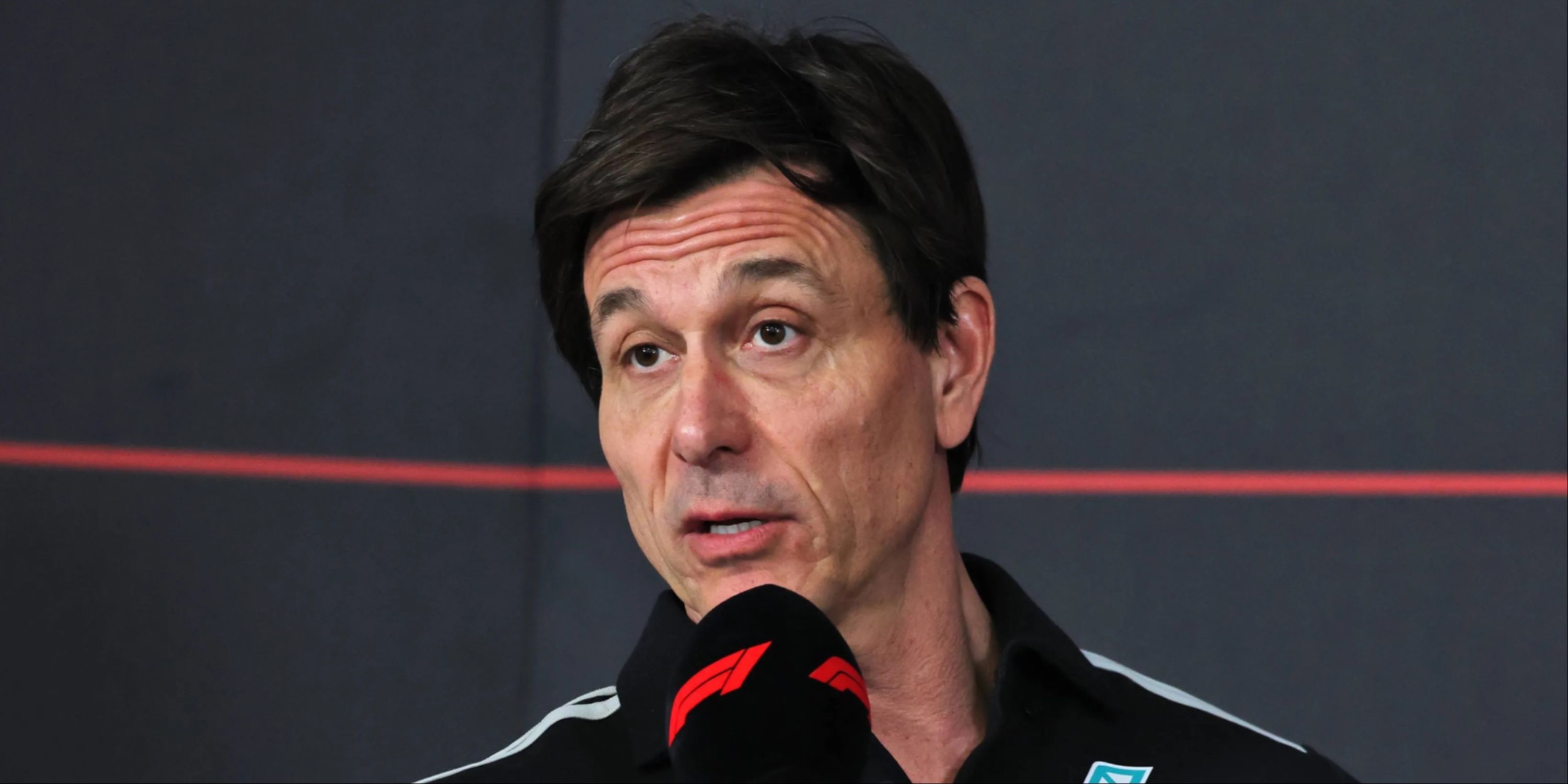 Toto Wolff speaking on a microphone