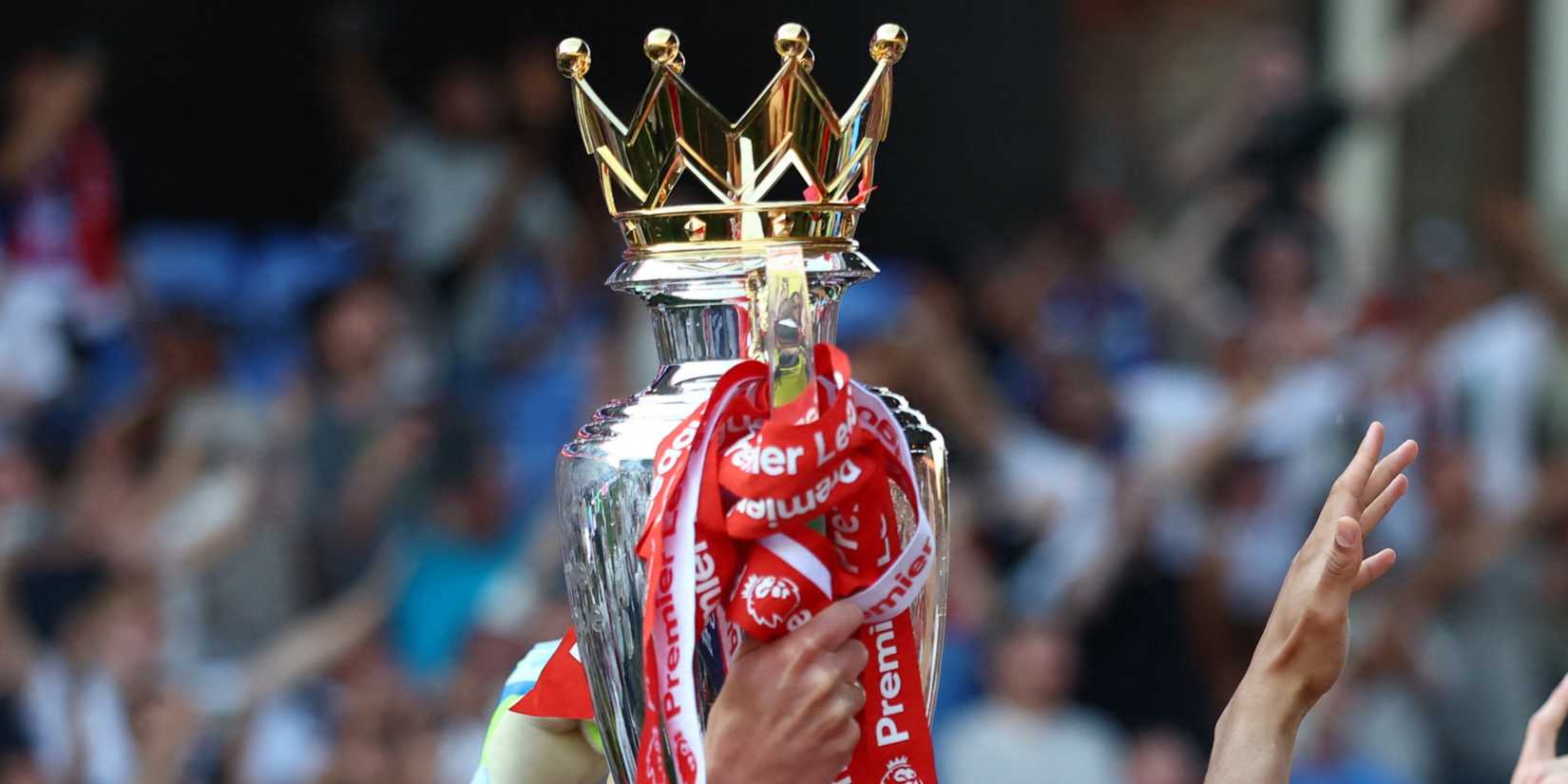 Premier League title shown with Arsenal ribbons of red and white