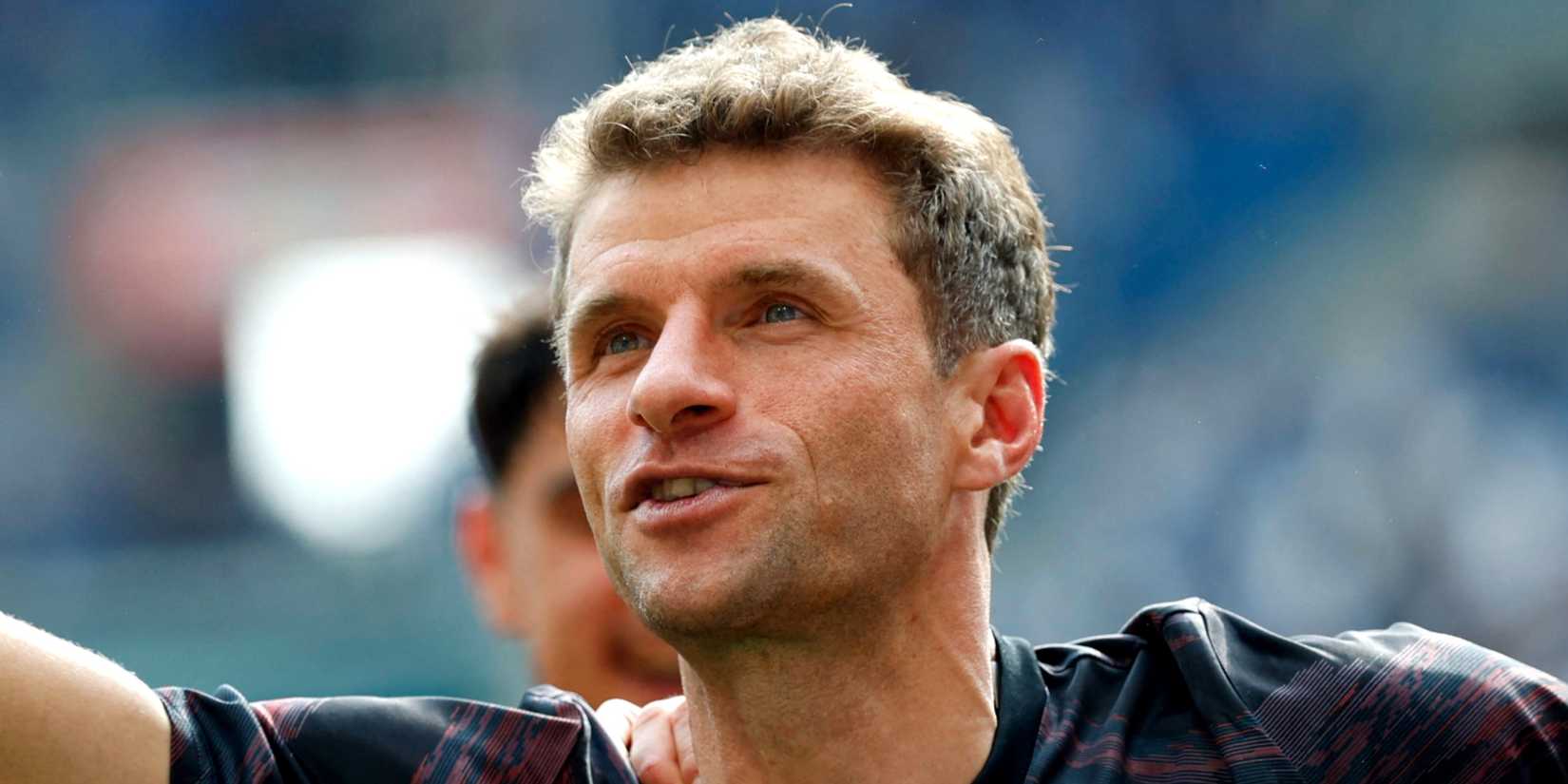 Thomas Muller celebrates after he played his last Bundesliga match for Bayern Munich
