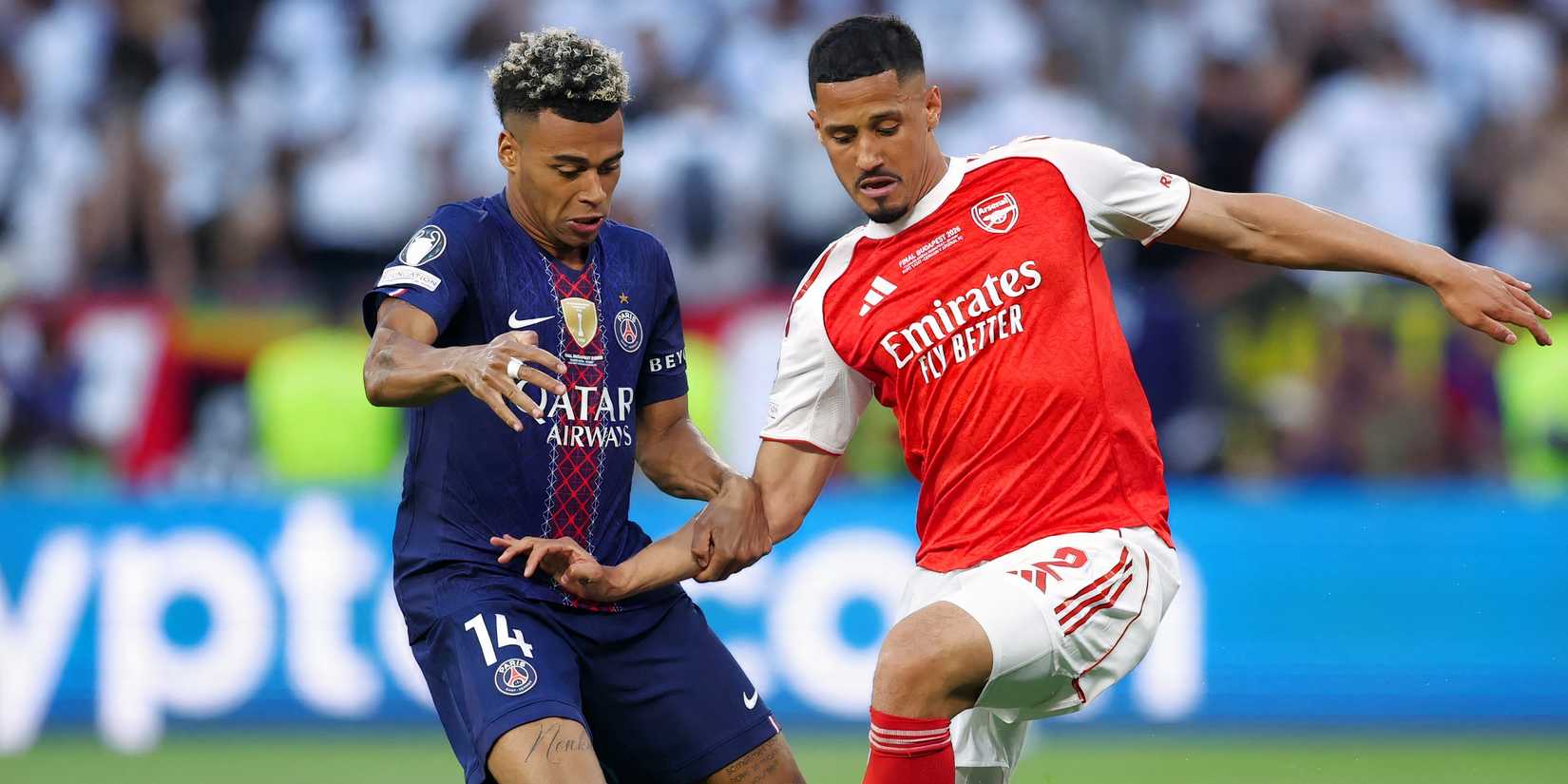 Desire Doue (L) of PSG challenges William Saliba (R) of Arsenal in the Champions League final
