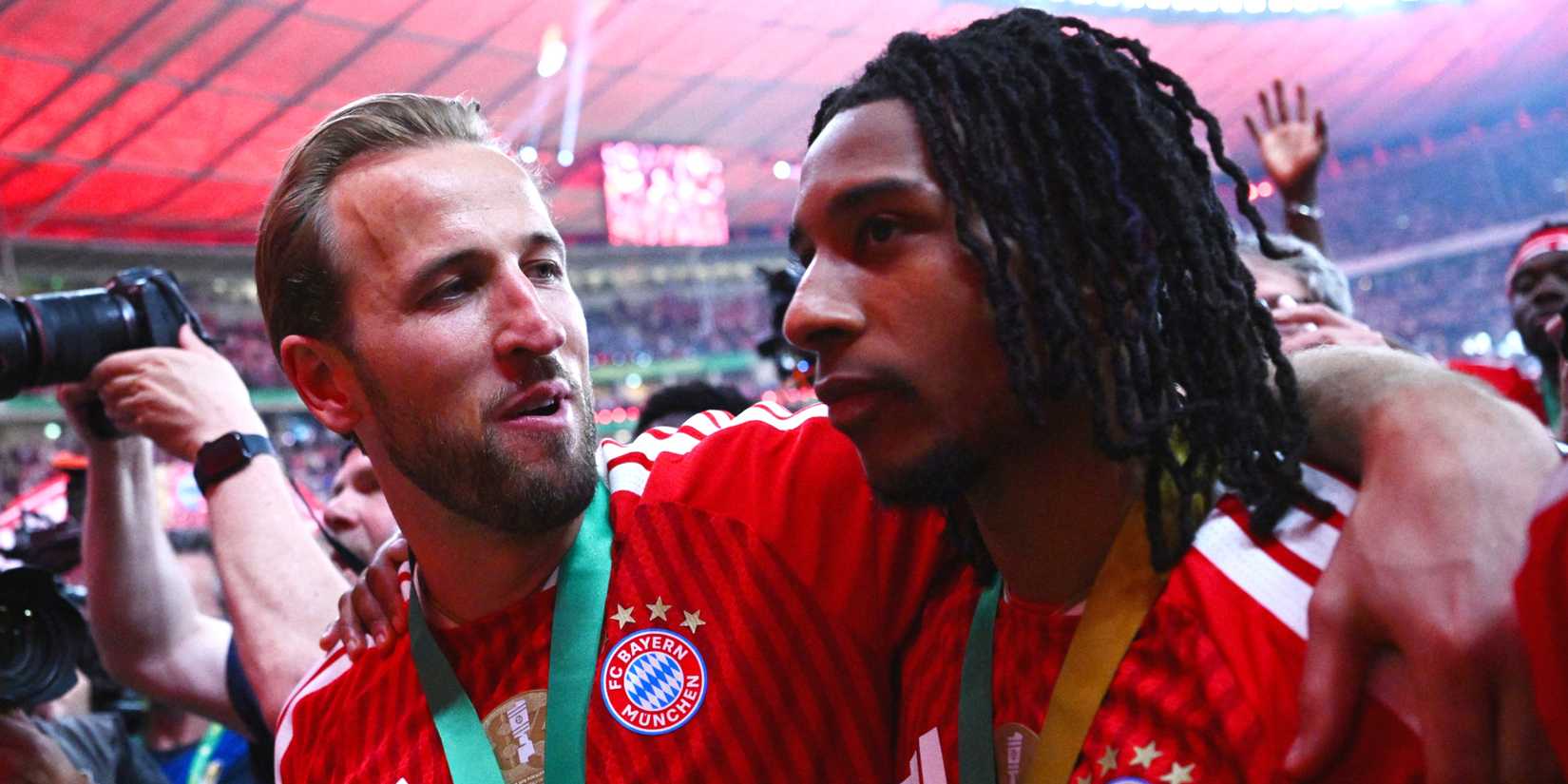 Bayern Munich's Harry Kane celebrates with Michael Olise after winning the DFB Cup