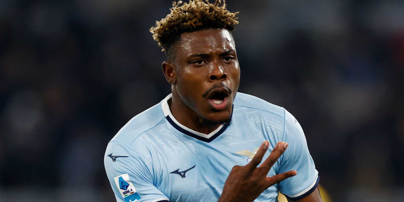 Fisayo Dele-Bashiru taps the badge after scoring goal for Lazio