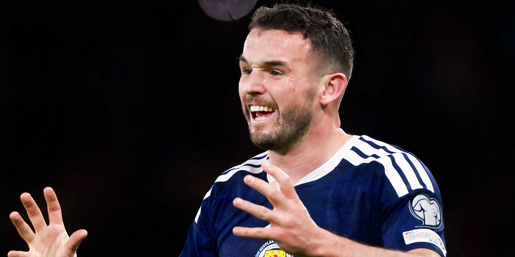 John McGinn gestures during a Scotland match