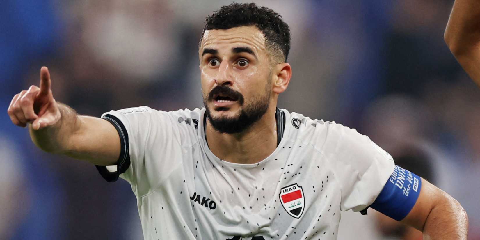 Iraq's Aymen Hussein points vs Bahrain