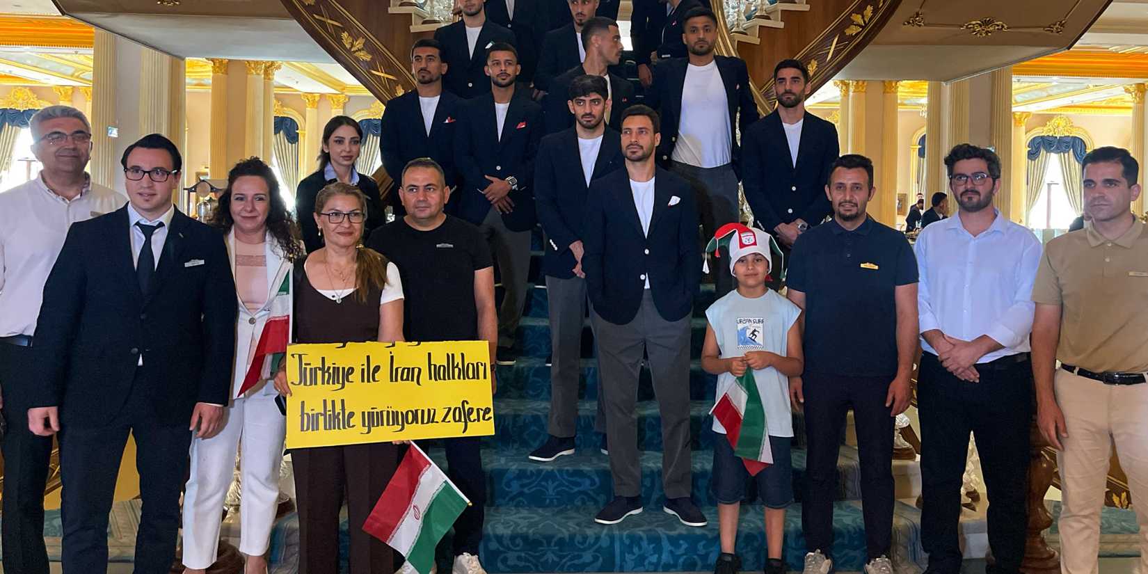 Iran's Mehdi Torabi and Alireza Jahanbakhsh poses with teammates and fans as they depart from Turkey to Mexico ahead of the World Cup