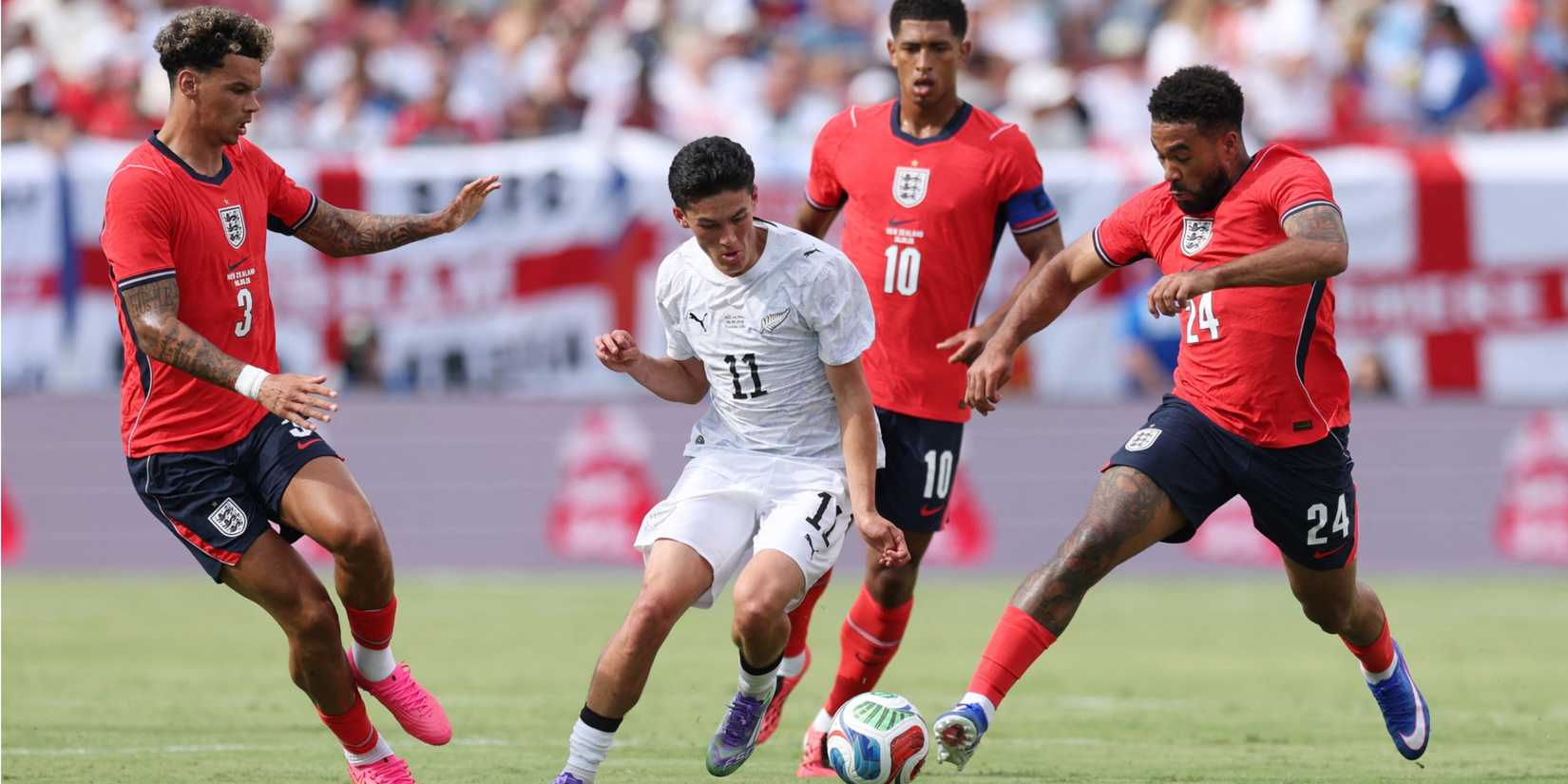 Reece James and Nico O'Reilly battle for the ball