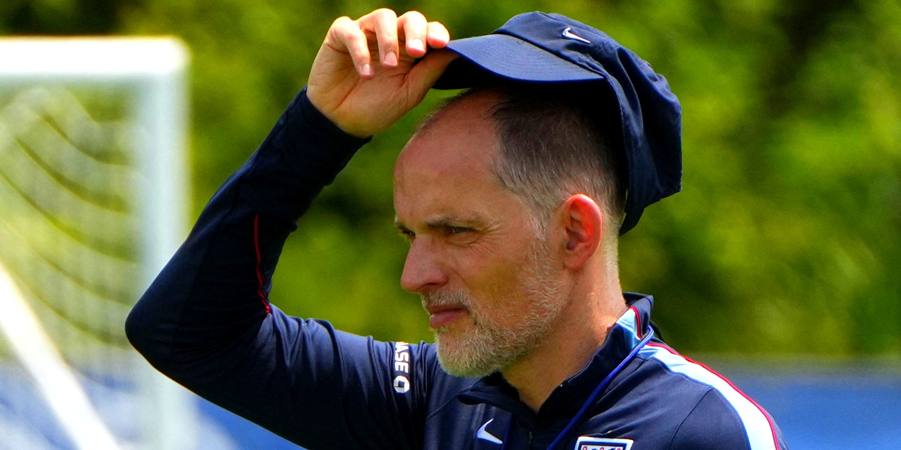 England manager Thomas Tuchel lifts his cap during training
