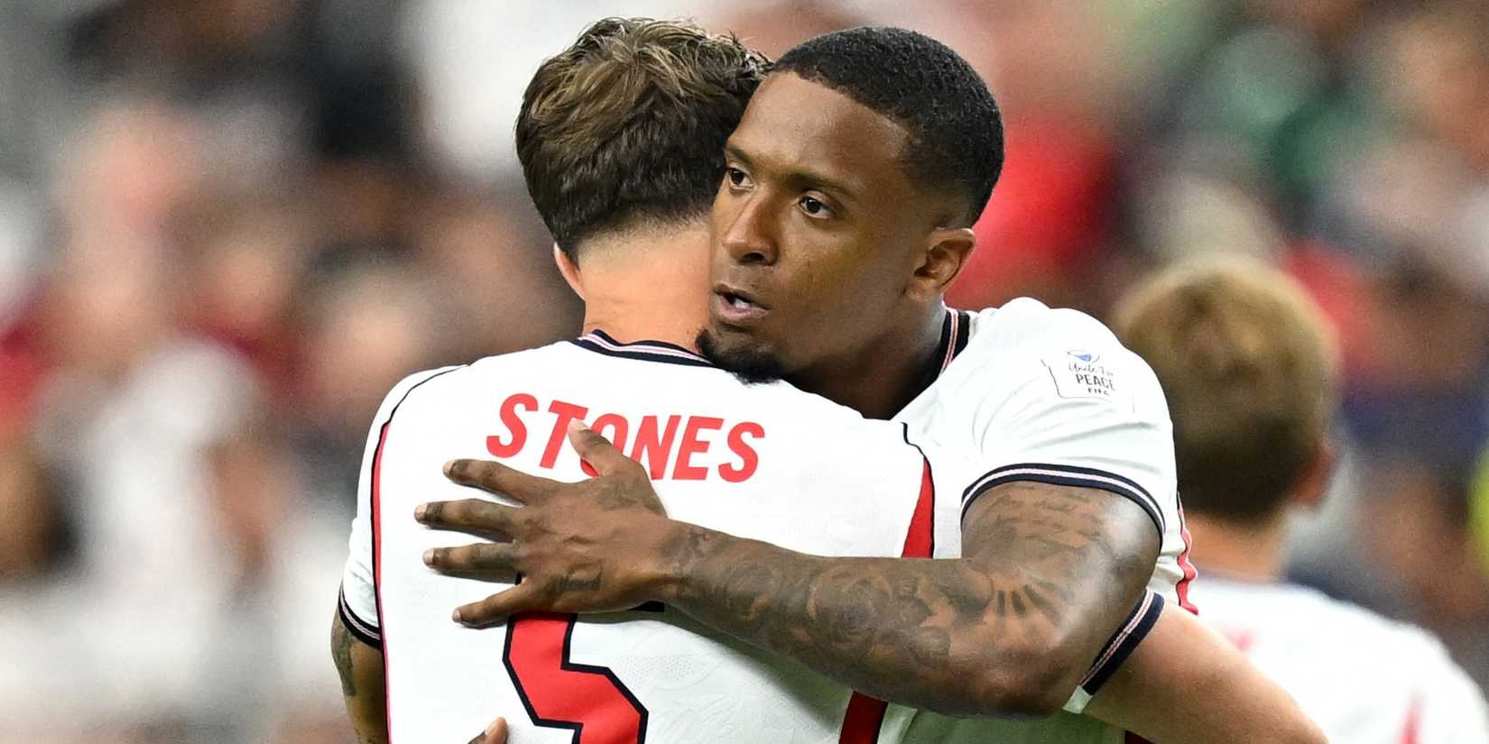 England's Ezri Konsa and John Stones embrace before the match vs Croatia