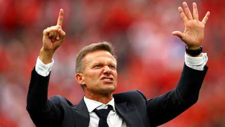 Canada coach Jesse Marsch signals six as he celebrates after the 6-0 World Cup win over Qatar