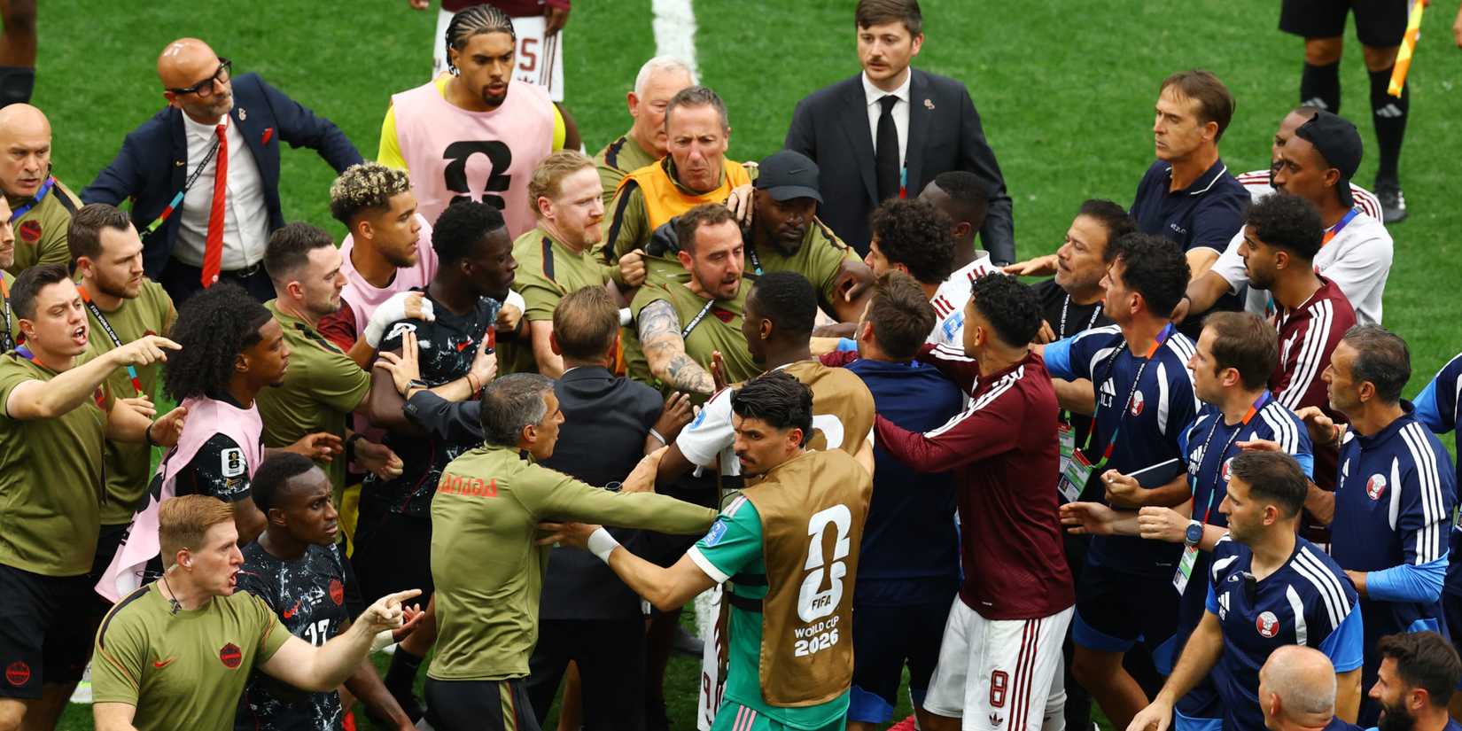 Canada and Qatar players clash