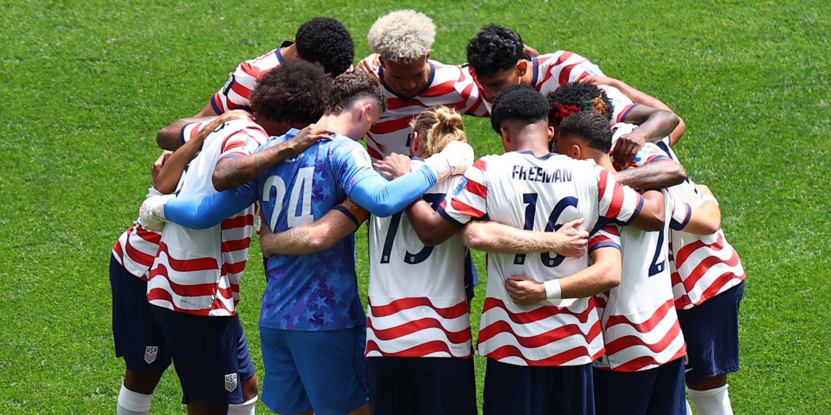 United States players in a team huddle