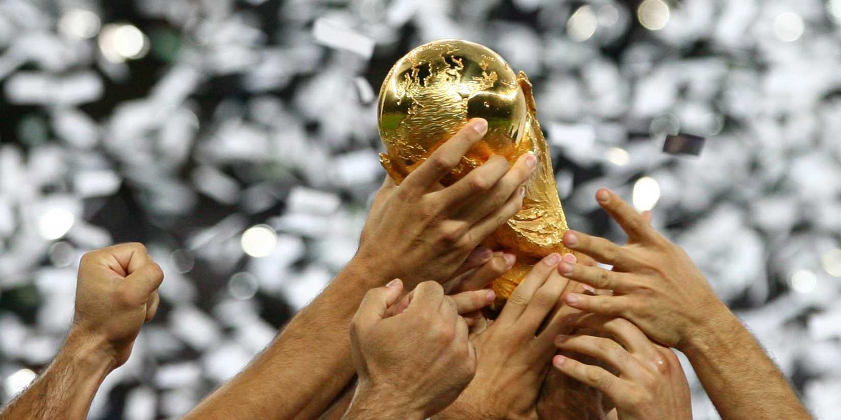 World Cup trophy general view; Italy players hold trophy aloft in 2006