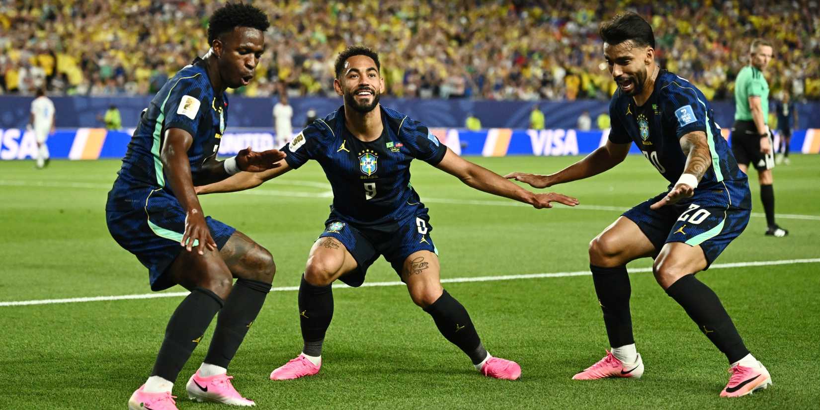 Matheus Cunha performing his surfing celebration with Vinicius Junior and Lucas Paqueta at the 2026 World Cup